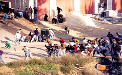 Photo: Demonstrators ducking as metal projectiles are fired at them
