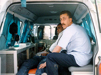 Photo: Medic in the back of a Palestinian ambulance.