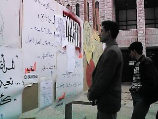 Photo: A voter reading the bloc campaign boards during the election