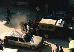 Photo: Palestinian police vehicle, with kids crowding around