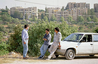 Photo: Adli talking with Kiryat Arba backdrop