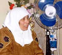 Photo: Mrs. Addassi tells the story in her home