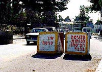 Photo: Concrete blocks on the road into central Ramallah