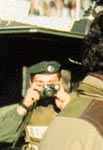 Photo: Israeli soldier snapping a shot of the crowd as his jeep pulls away