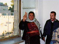Photo: Old woman rejoicing inside the police station