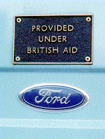 Photo: Plate on back of Ford van reading 'Provided under British aid'.