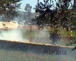 Photo: Student runs through the teargas.