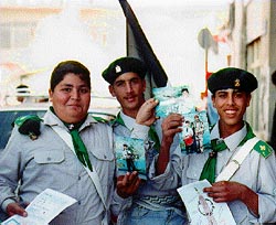 Photo: Boy scouts display photos in which they are posing with guns