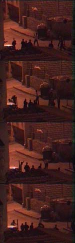 Video-captured stills: Police and various Palestinian security officials open fire down streets near Ramallah police station.