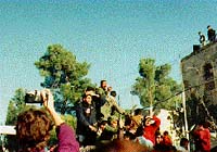 Nigel photographing the redeployment form Ramallah police station in 1995. Click for related diary entry.